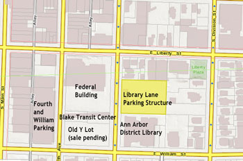 The Library Lane parking deck is highlighted in yellow. The name “Library Lane” is based only on the proximity of the structure to the downtown location of the Ann Arbor District Library. The library does not own the structure or the mid-block cut-through. (Base image from Washtenaw County and City of Ann Arbor GIS services.)