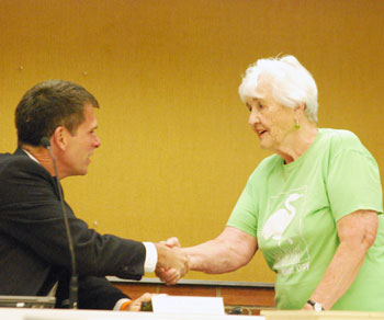 Eunice Burns, former city councilmember and DDA board member, introduces herself to city administrator Steve Powers before the council meeting started. Burns was on hand to receive a proclamation for Huron River Day, which falls on July 15 this year. Burns, along with Shirley Axon, is cofounder of the event.