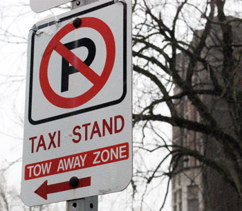 Taxi stand sign on State Street in front of the Michigan Union.