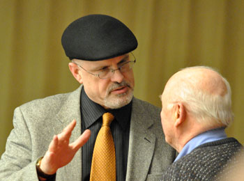 Architect Brad Moore (left) talks with resident Ray Detter. Moore is architect for two projects that were on the council's March 4 agenda – Blue Heron Pond and 624 Church St. The councils approval of both site plans indicates the council is not contemplating imposing a Moore-atorium on site plans.