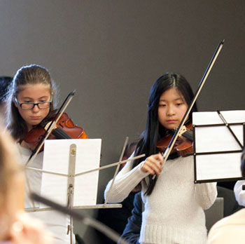 Tappan Middle School orchestra students performed for the board.