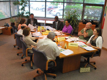 The AAATA board's special meeting was held at the headquarters building at 2700 S. Industrial Highway. Clockwise starting at the head of the table: Charles Griffith, Michael Ford, Susan Baskett, Eli Cooper, Gillian Ream, Eric Mahler, Sue Gott, Roger Kerson, and Anya Dale.