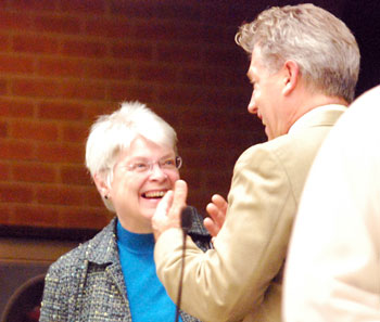 Marcia Higgins (Ward 4) and Stephen Kunselman (Ward 3) share a light moment before the meeting started. They had both contested Democratic primaries two days earlier. Kunselman prevailed in a narrow race. Jack Eaton won the Ward 4 race. 