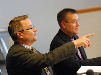 AAATA controller Phil Webb makes a literal point before the meeting. Seated next to him is Bill De Groot, Bill De Groot, an AAATA financial analyst and planner.