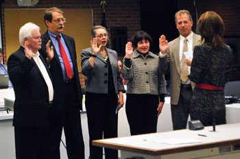 Swearing in of the councilmembers who won election on Nov. 5, 2013. From left to right: Mike Anglin (Ward 5), Jack Eaton (Ward 4), Sabra Briere (Ward 1), Jane Lumm (Ward 2) and Stephen Kunselman (Ward 3). Administering the oath was city clerk Jackie Beaudry.