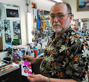 At his downtown barbershop, shortly after getting the news that the court had ruled in his favor, Bob Dascola showed The Chronicle photos of himself as a clown participating in Ann Arbor s Fourth of July parade – something he has done for several years. He will be participating again this year – also as a clown, not as a city council candidate, because he's already registered his parade entry that way.