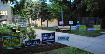 At 6:30 a.m. the  lawn outside the Slauson Middle School polls was bristling with campaign yard signs just outside the 100-foot limit. 