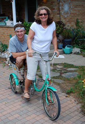 With the three-wheeler she bought from Reuben Chapman at his garage sale, Liz Brauer used to haul her son Nico up and down Liberty Street. He was younger (and smaller) then.