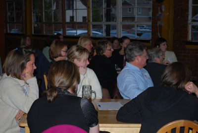 Participants of Tuesday Creative Conversations listen to panelists at the Corner Brewery.