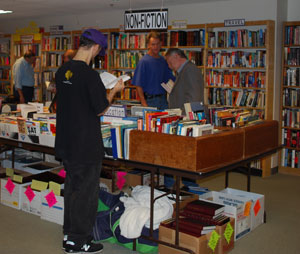 Customers browse books at the Friends of the Library shop, in the basement of the downtown Ann Arbor District Library.