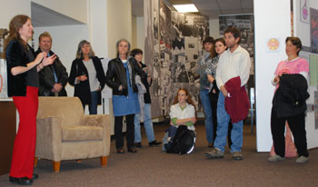 Julie Herrada, left, explains the origins of the exhibit. 