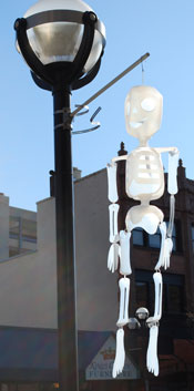 Skeletons made of milk cartons hung from light posts downtown, courtesy of the Main Street Area Association.