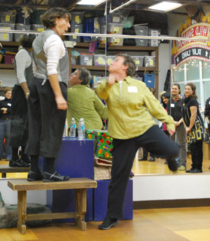 Hilary Cohen and Sandy Ryder of Wild Swan Theater demonstrate an improv bit at Tuesday night's Creative Connections event.