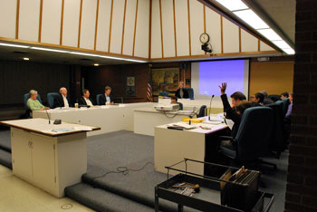 Ethel Potts raises her hand in opposition to the final vote to recommend to city council the on the A2D2 zoning