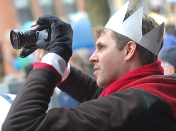 Guy with crown photographing Festifools