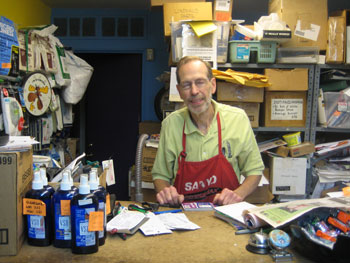 Dick Sampier, in his epymonious vacuum sales and repair shop.