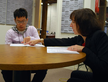Tomohisa Fujiwara, an intern with Menlo Innovations, gets pronunciation instruction from Barb Niemann, director of curriculum and training for the Accent Reduction Institute