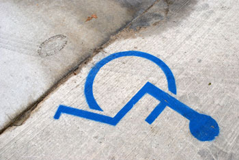 wheelchair universal access stencil on concrete slab