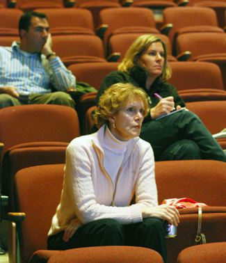 Kathy Griswold, foreground, attended a millage forum at Huron High School's Little Theater. She is a former AAPS school board member and a leader of the Citizens for Responsible School Spending, which opposes the millage.