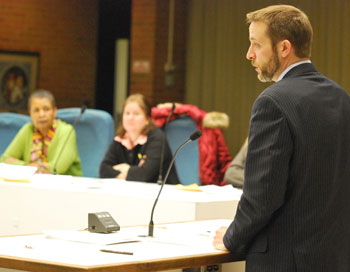 Developer Jeff Helminski speaks to Ann Arbor planning commissioners about his project, The Moravian. In the background are commissioners Wendy Woods and Diane Giannola. (Photos by the writer.)