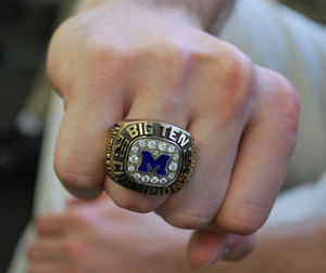 Big Ten championship ring on the hand of a UM gynmast