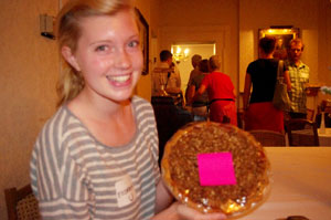 Pie lover Elizabeth Knight proudly presents her winnings from a pie-walk.  (Photo by Sarah Marshall)