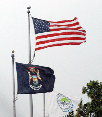 Flags flying over Pittsfield Township Hall on June 27, 2013: Political winds were also blowing – but indoors.
