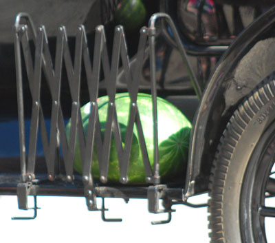Watermelon on a sideboard.